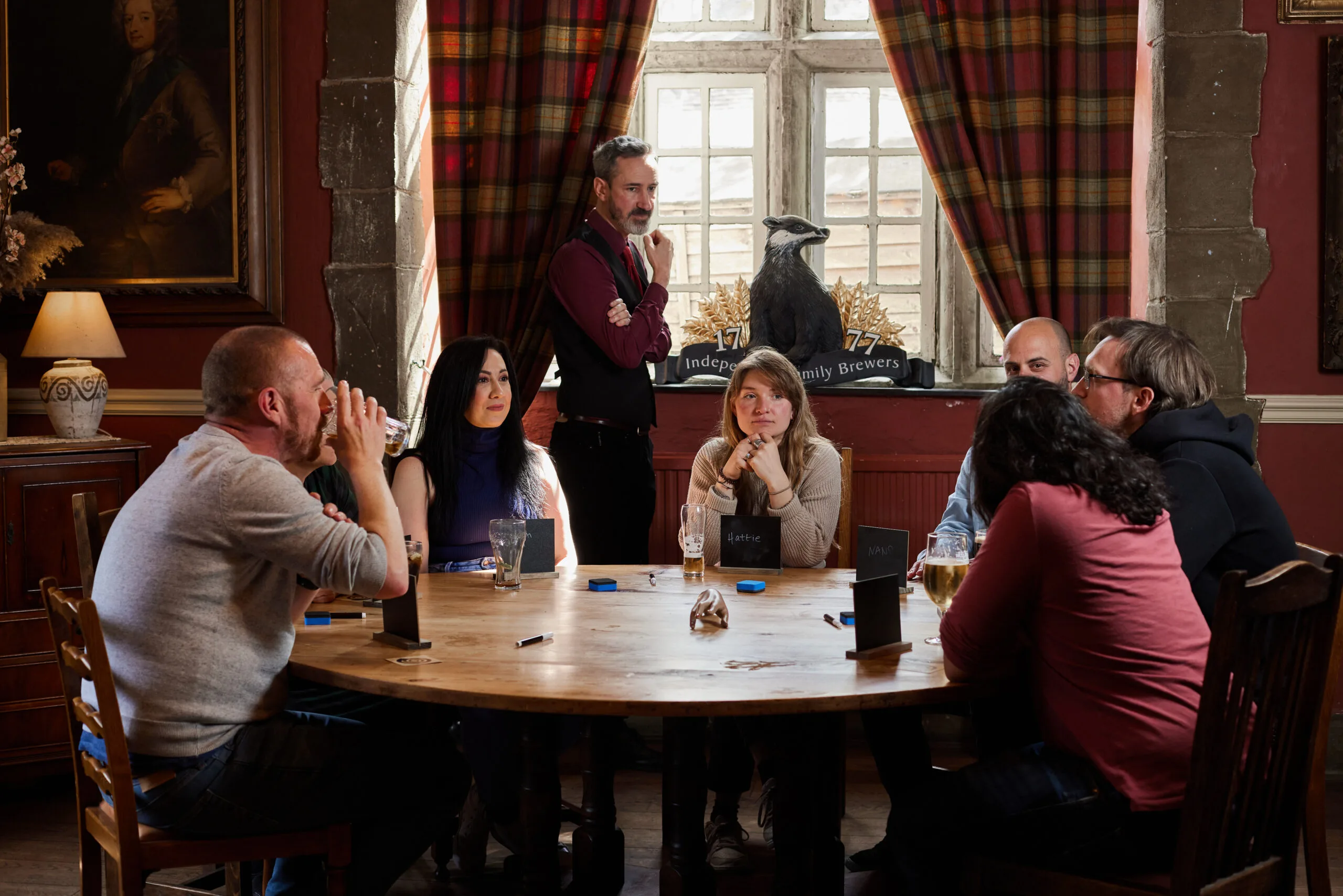 a group of people playing a teambuilding game of traitors
